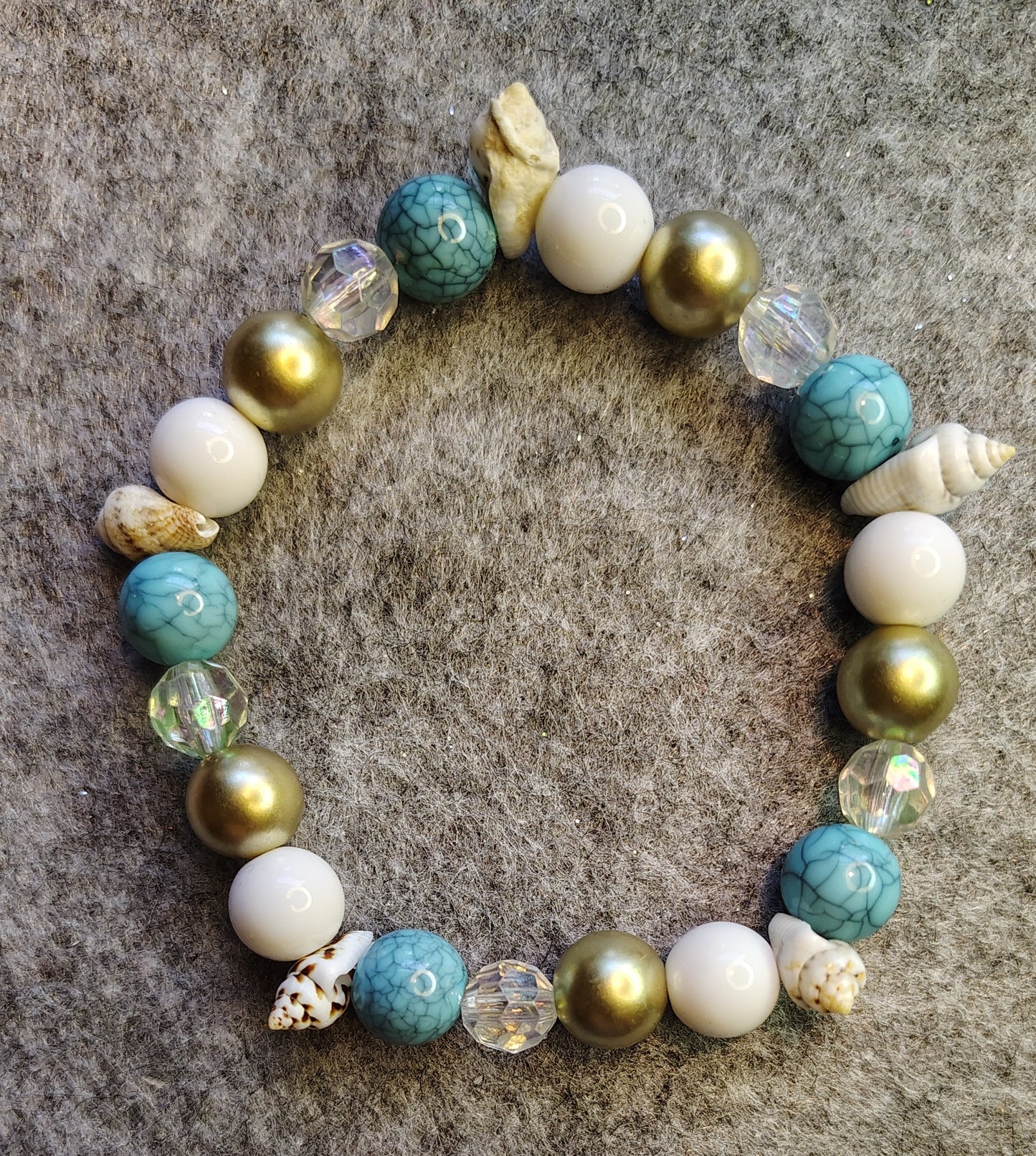Handmade stretchy bracelet, turquoise, white, gold, clear and seashells