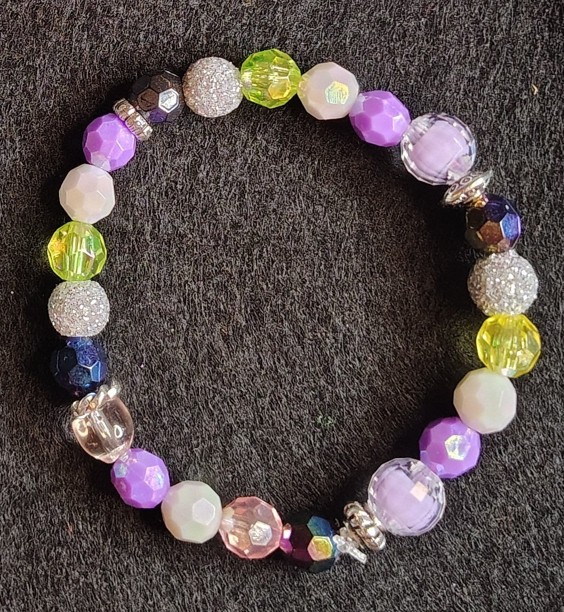 Handmade stretchy bracelet Multi-Color, purple, clear, yellow, silver glitter , blue, white