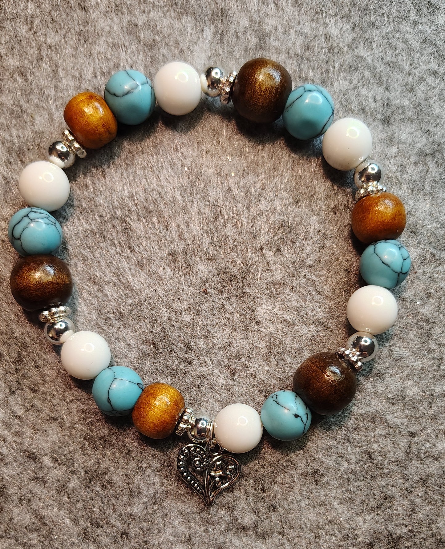 Handmade stretchy bracelet, turquoise, white, wood, silver beads. Silver heart charm