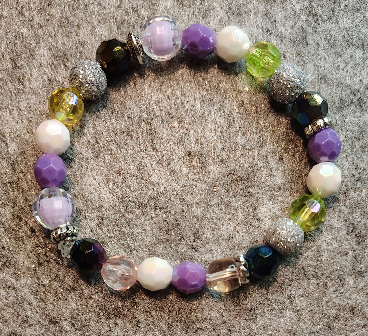 Handmade stretchy bracelet Multi-Color, purple, clear, yellow, silver glitter , blue, white